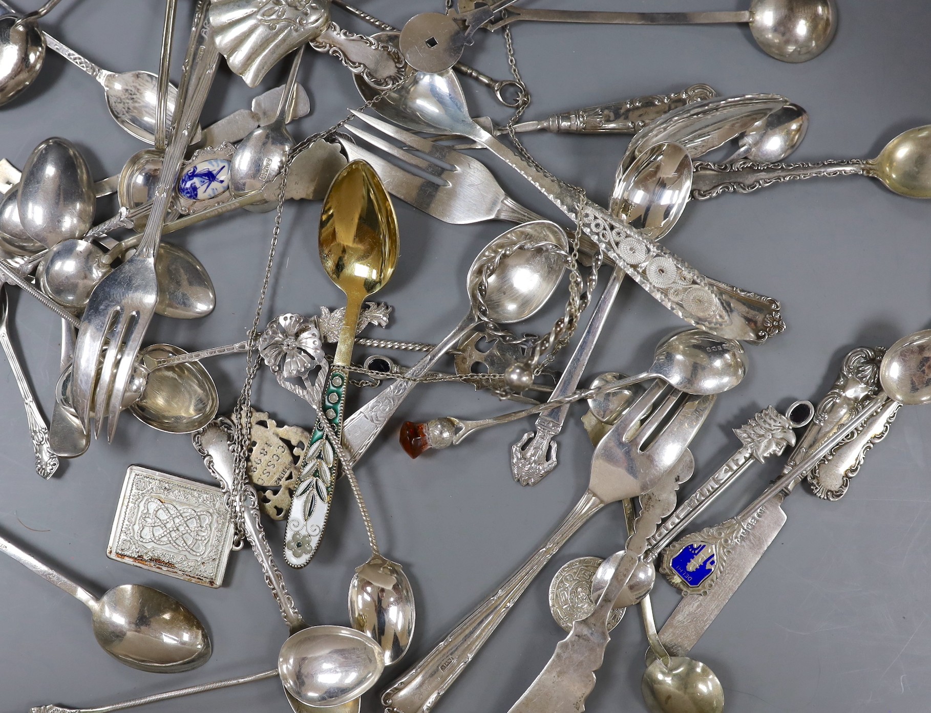 A small quantity of assorted small flatware including sterling, plated, silver and continental white metal including a David Andersen pickle fork.